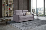 The ultimate high-back 2.5-Seater Sofa Bed shown from an angle, in light grey fabric, fully closed, in a roomset